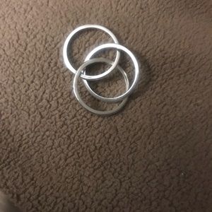 3 interlocking silver rings